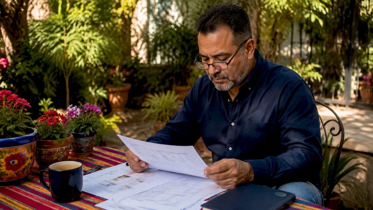 HVAC manager reviewing technician schedules